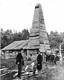  < Drake en haut-de-forme devant son puits en 1866 >